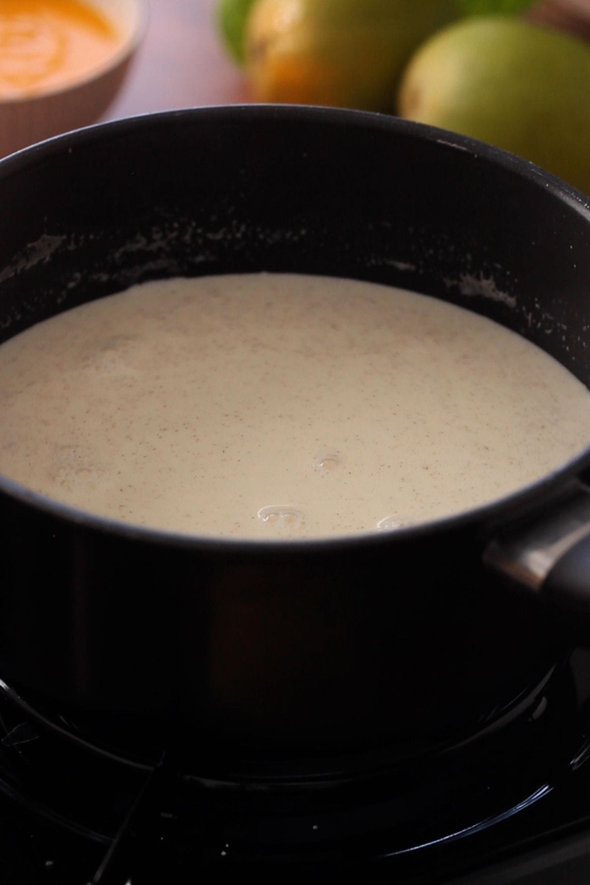 Simmering panna cotta mixture on a low flame.