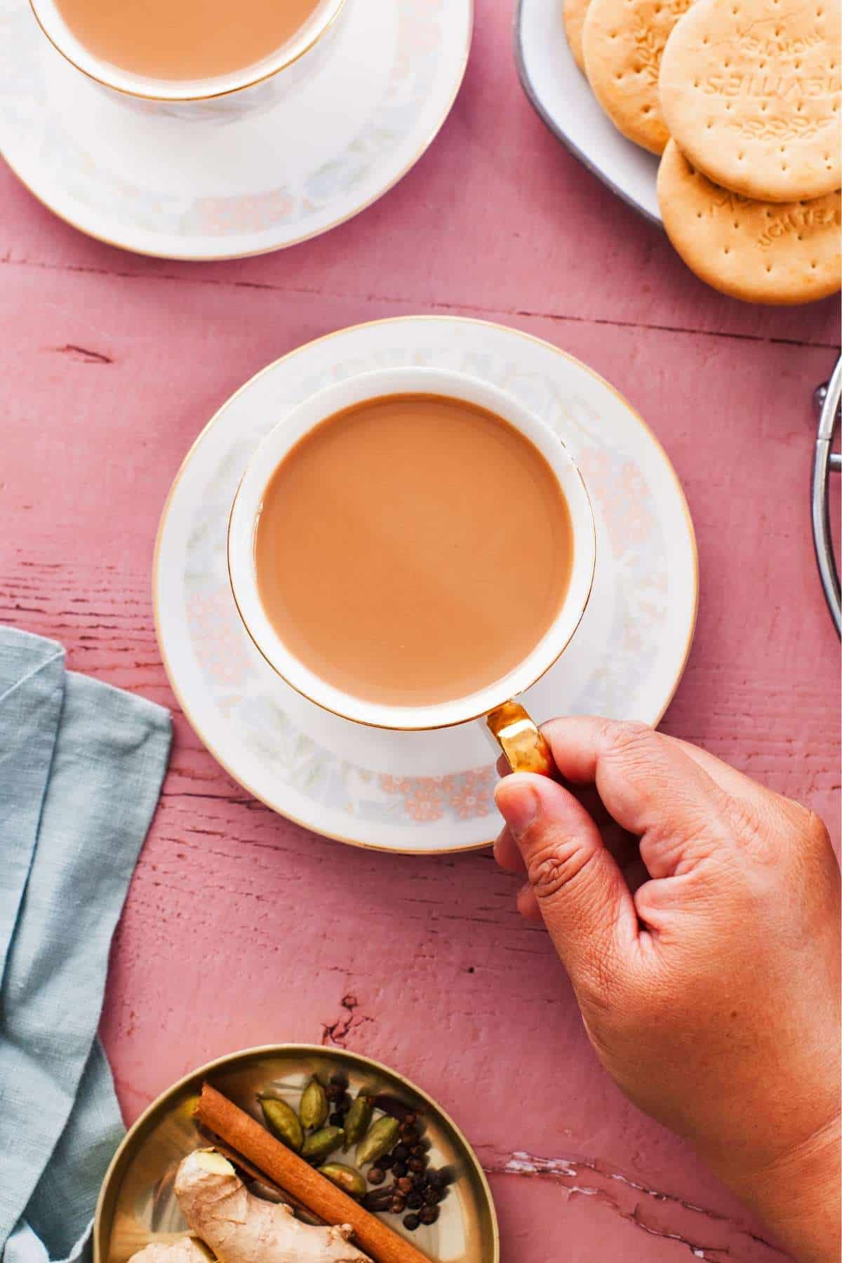 Overhead view of indian chai served with tea cookies.