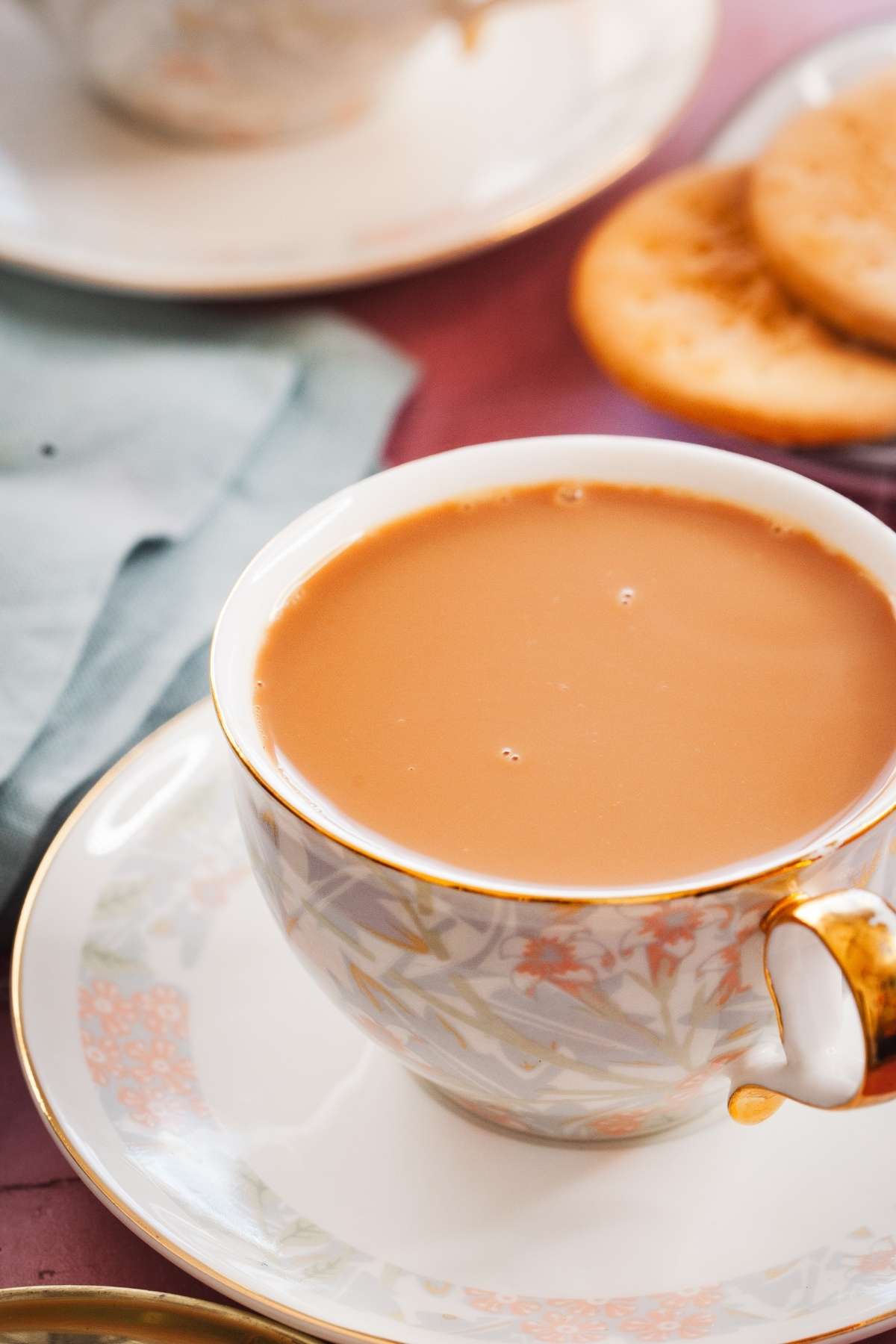 Close up shot of indian milk tea in a white procelain cup. 