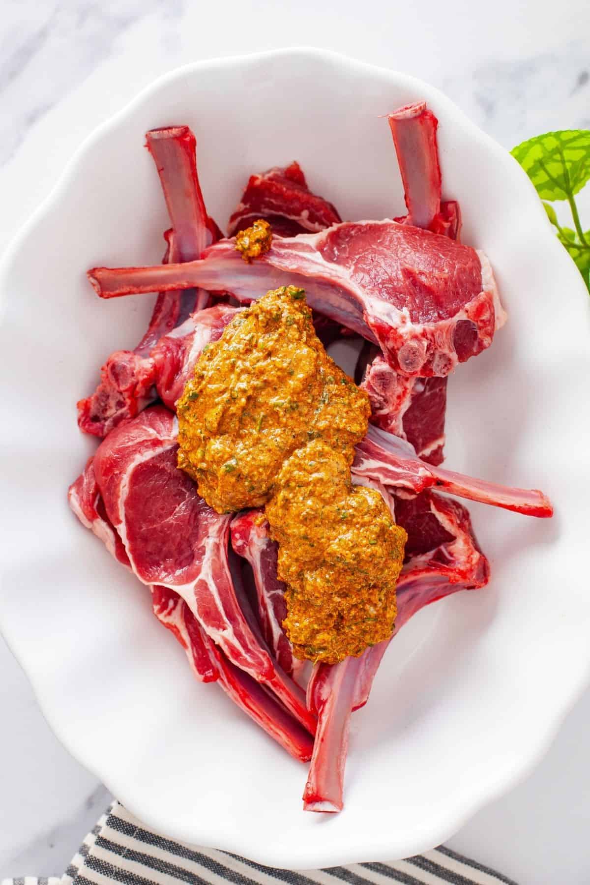 Tandoori marinade is added over lamb chop.
