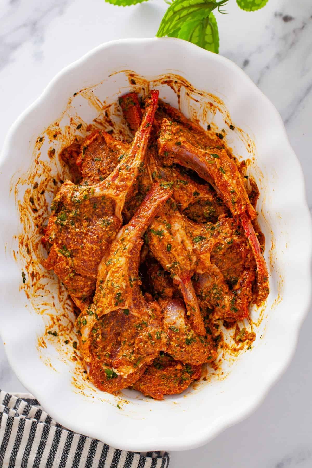 Lamb chops covered in spicy marinade.