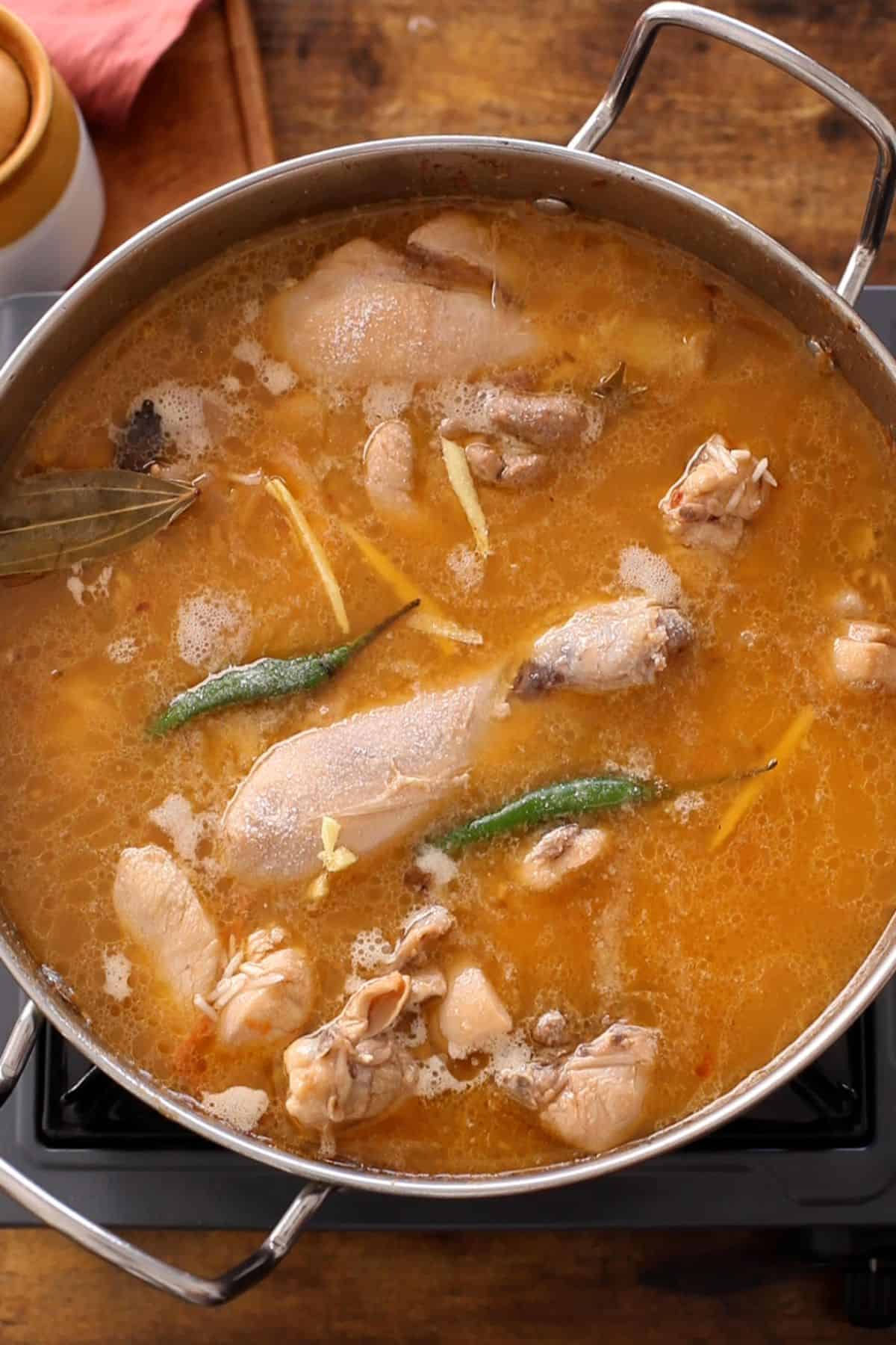 Water added for chicken pulao to cook on stovetop.