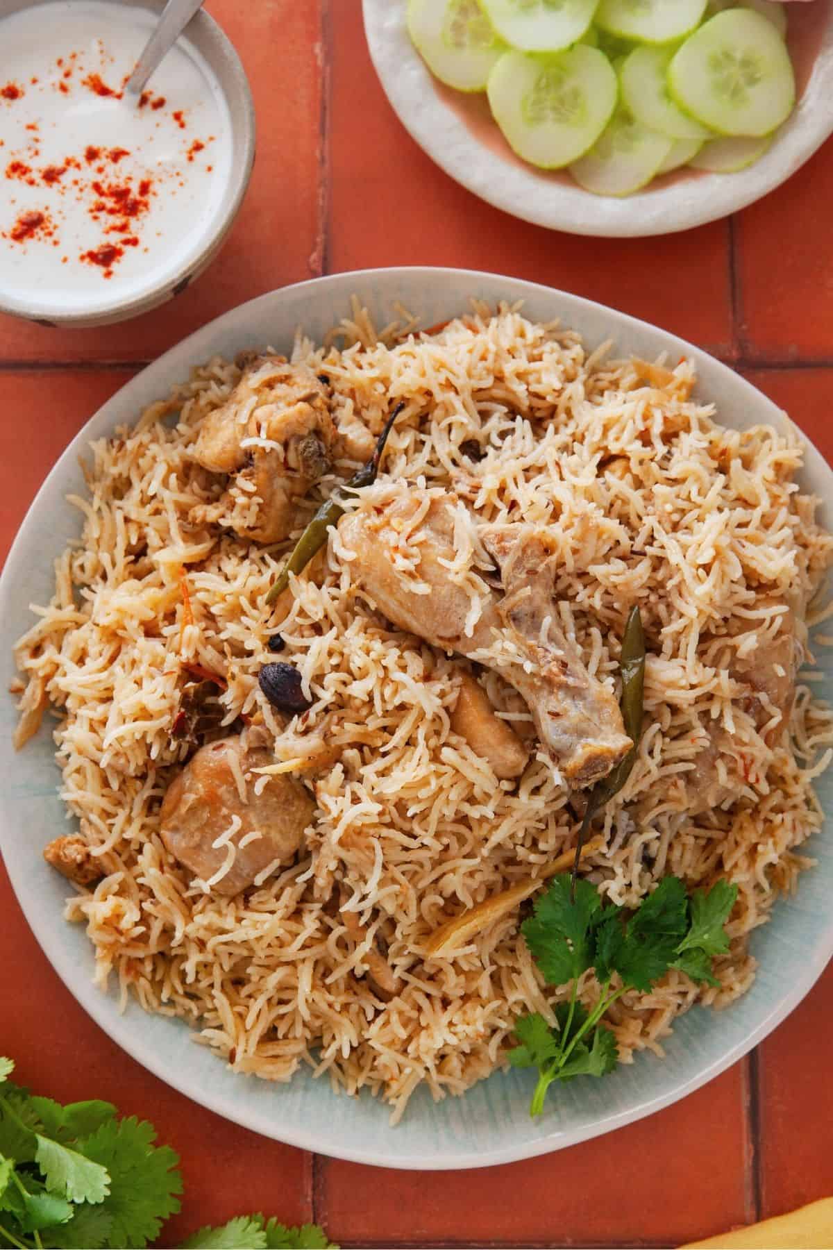 Chicken pilaf placed on a tiled background.