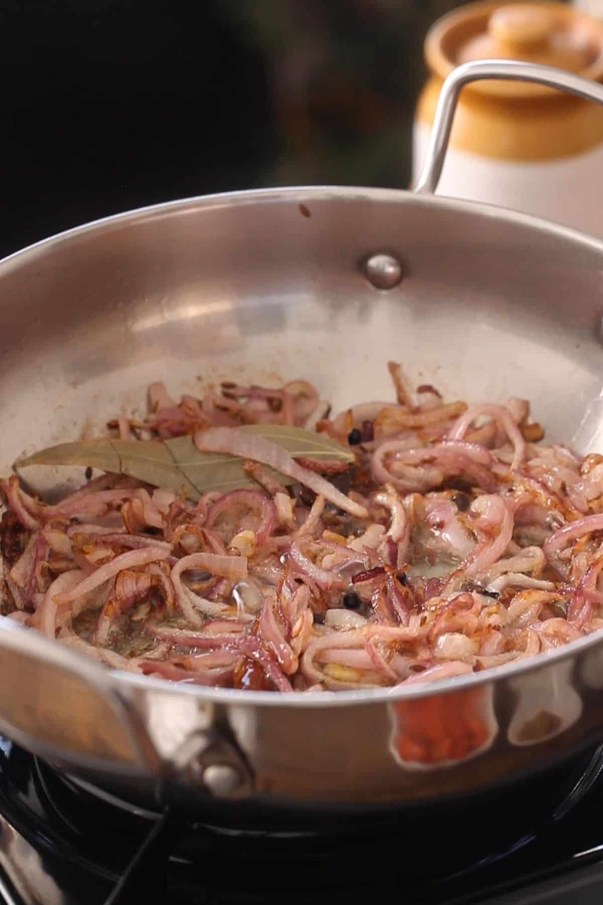 Browned onions in a cooking pot.