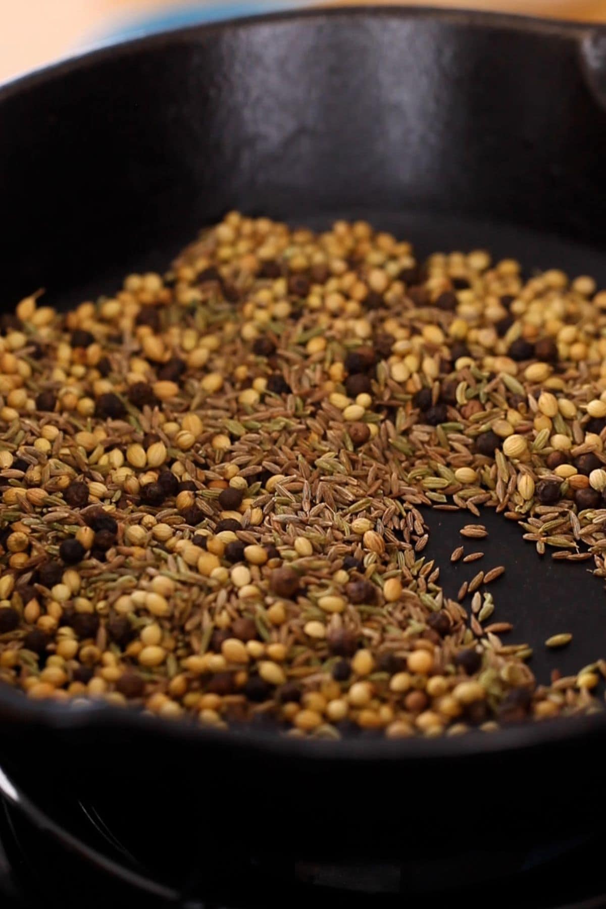 Roasted spices in a cast iron skillet.