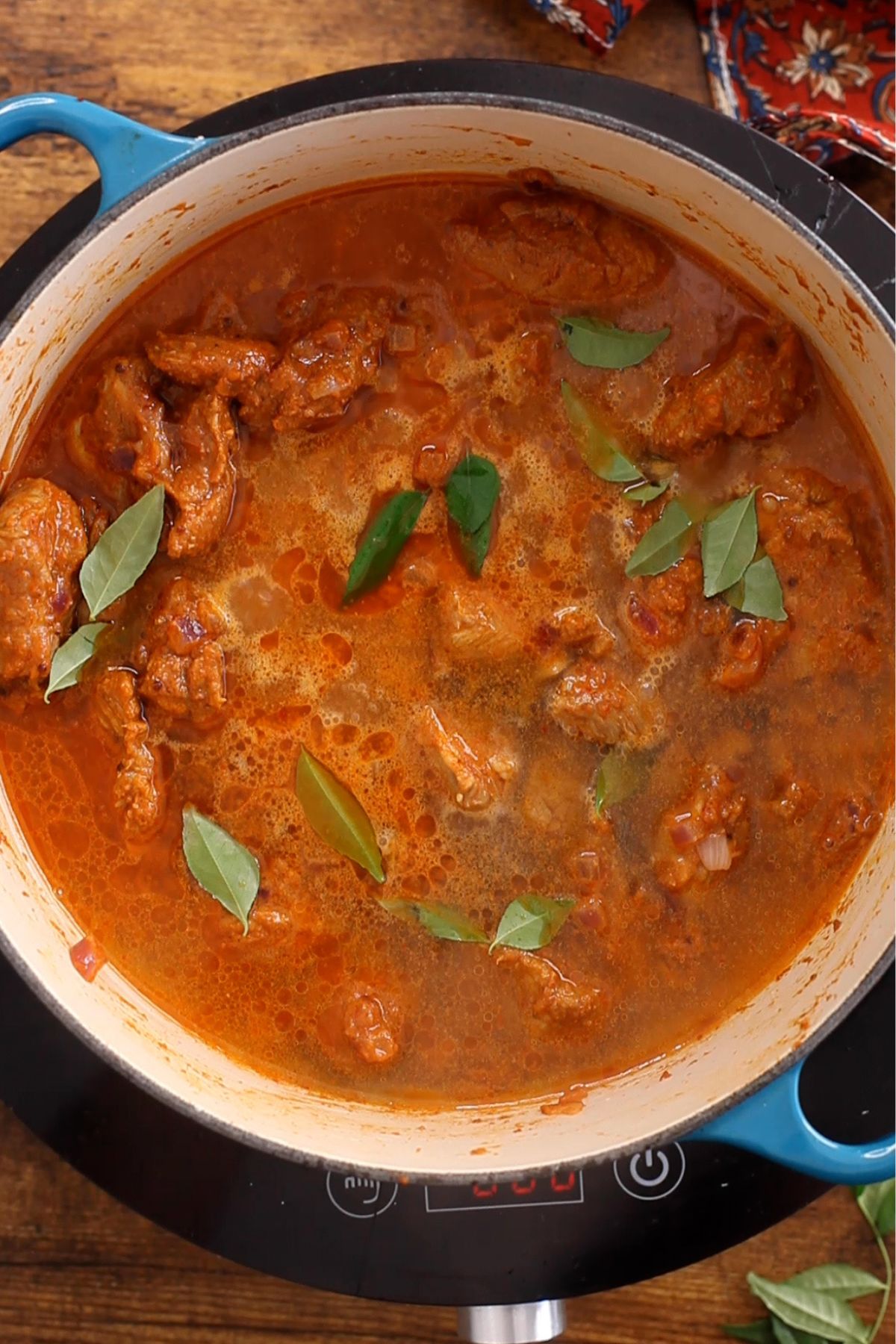 Hot water is added to vindaloo curry.