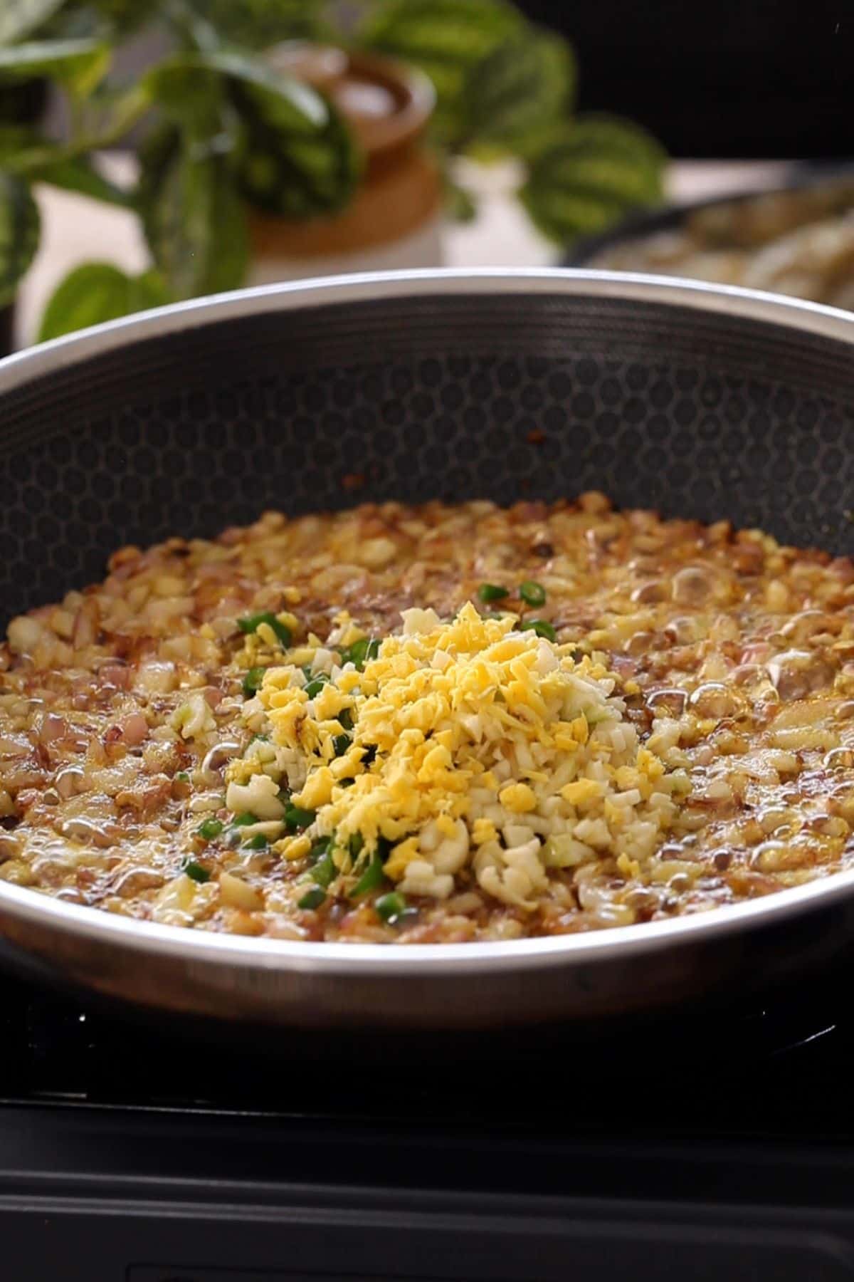 Aromatics are added to browned onions.