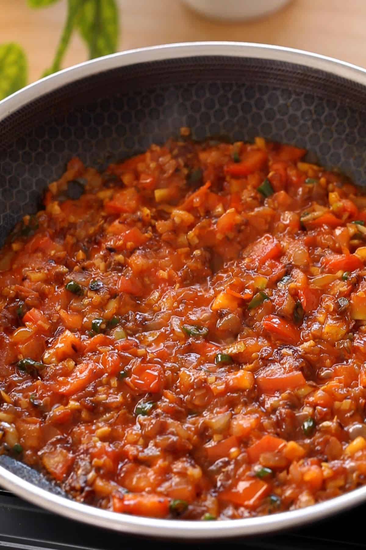 Tomatoes are cooked until jammy but holding shape.