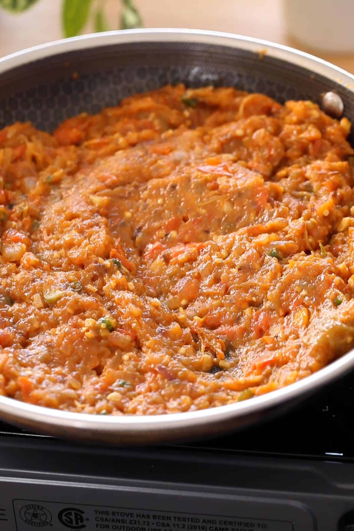 Eggplant bharta is slow cooked with masala until shiny and browned.