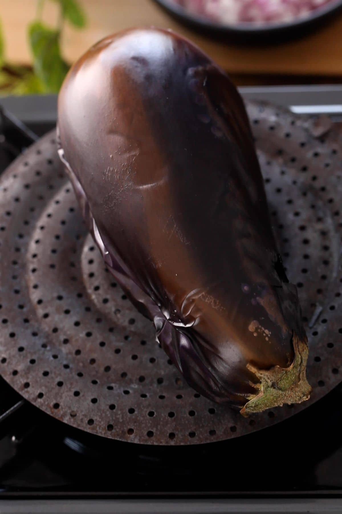 Italian Eggplant on a roasting pan on gas stove.