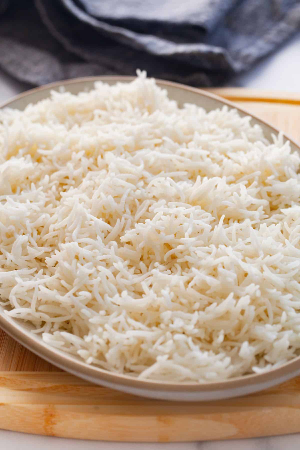 Side view of white basmati rice in an oval plate.