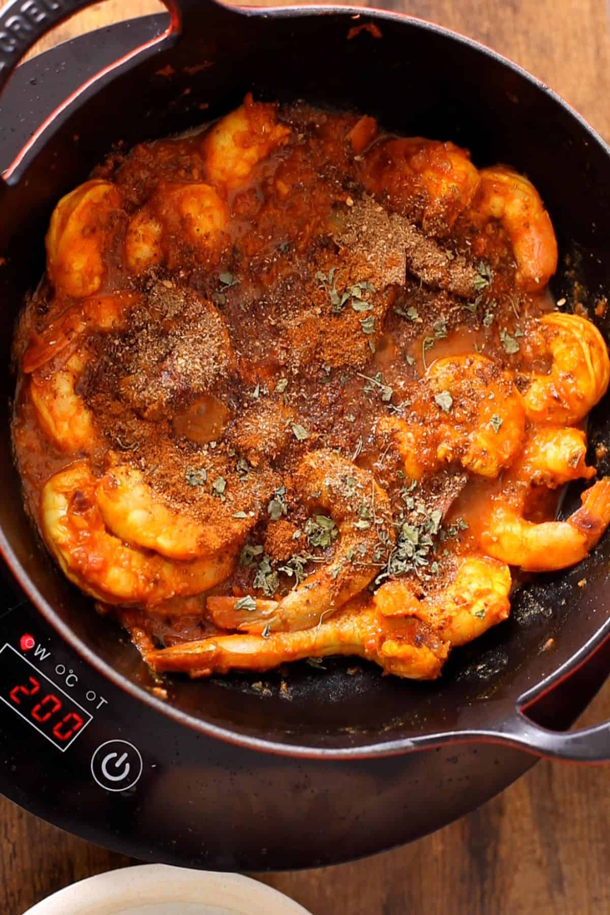 Kadai masala is added to the cooked shrimp.
