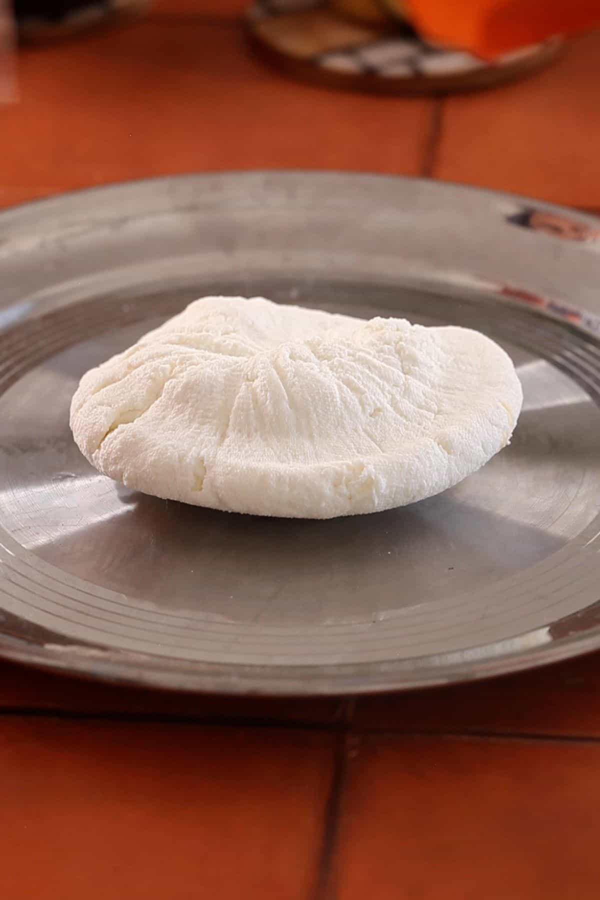 Block of chenna on a steel plate.