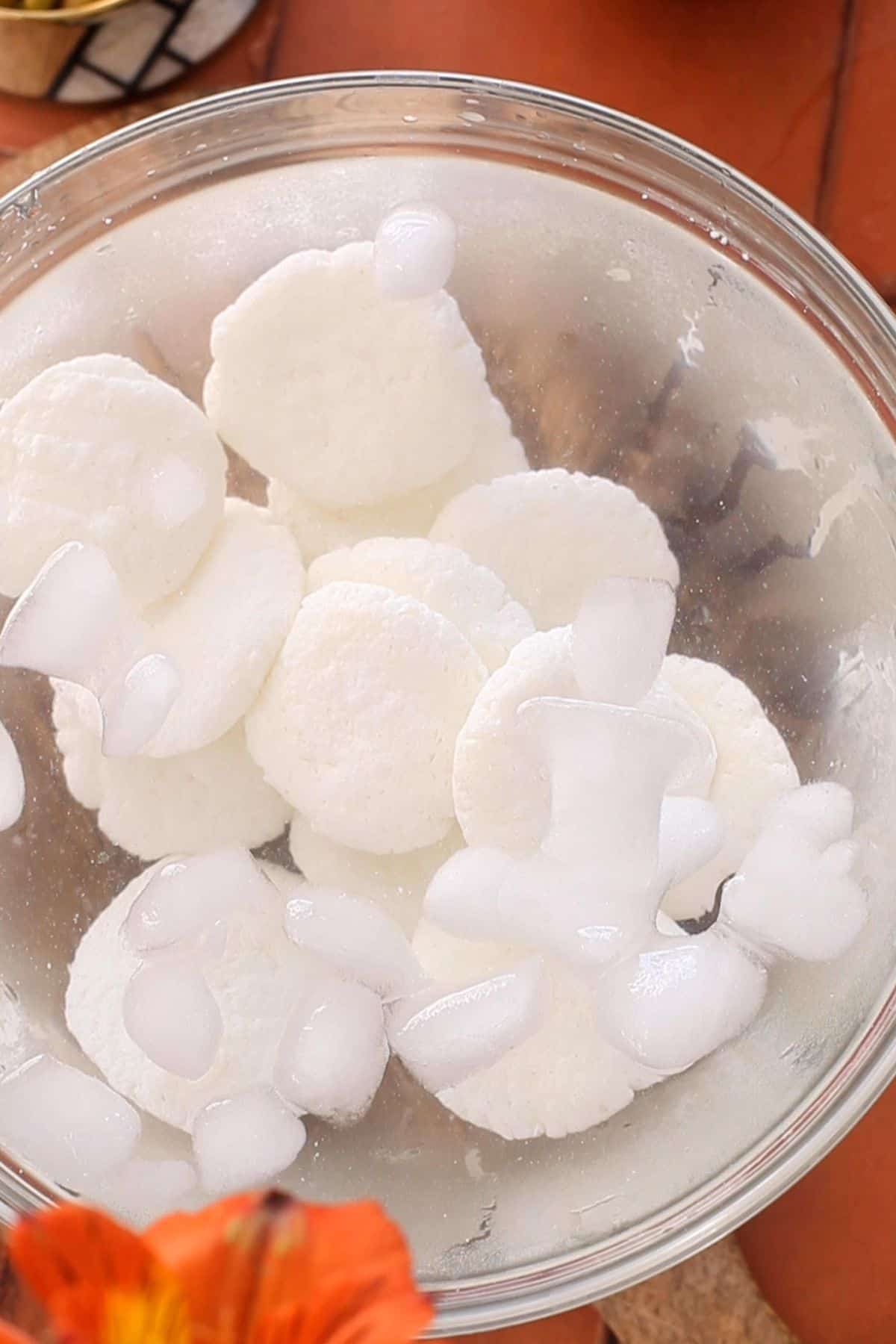 Cooked chenna patties are blanched in ice cold water.