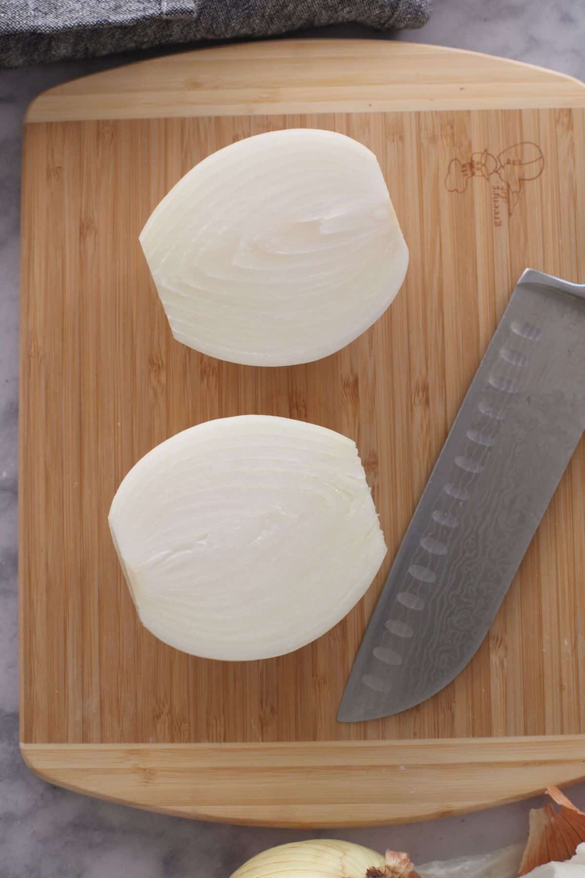 Peeled onions cut into half. 