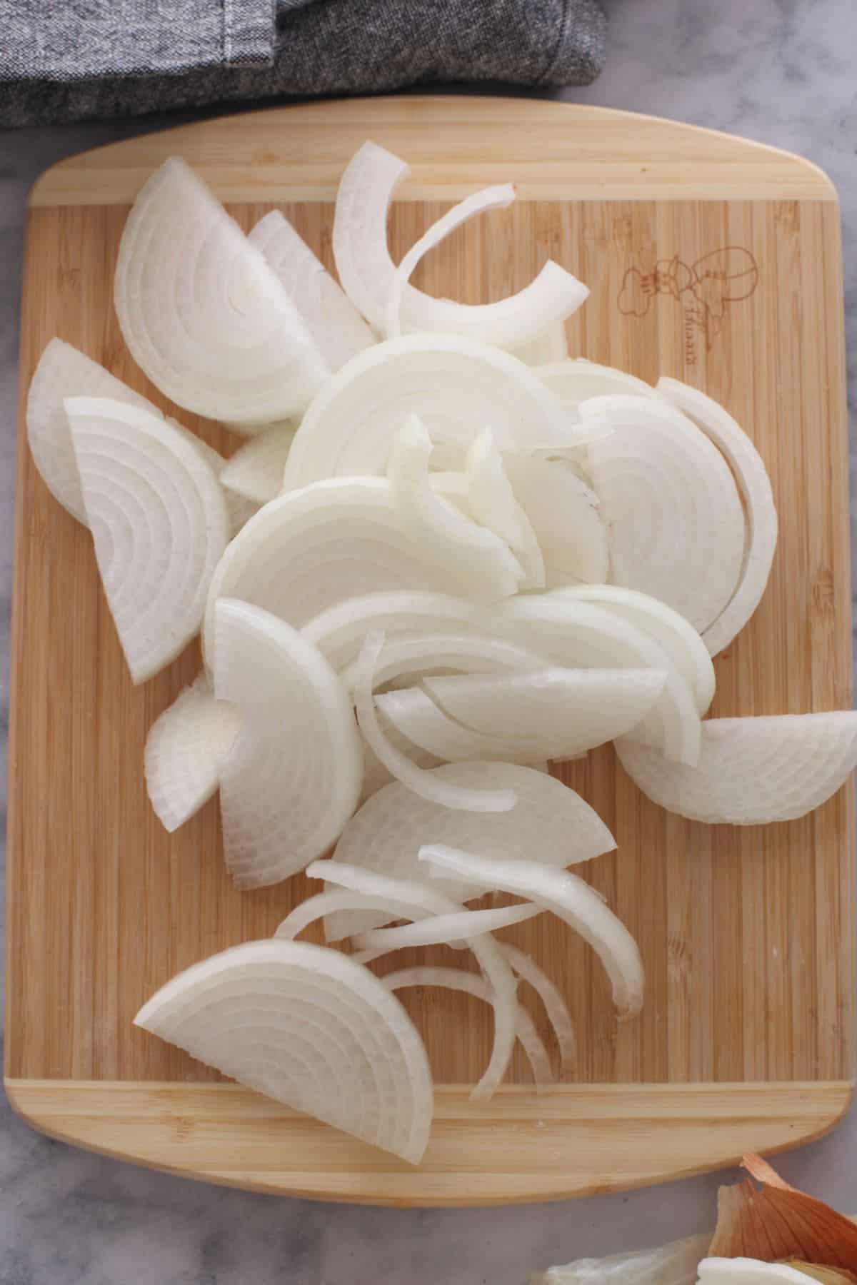 Onion sliced into half moons. 
