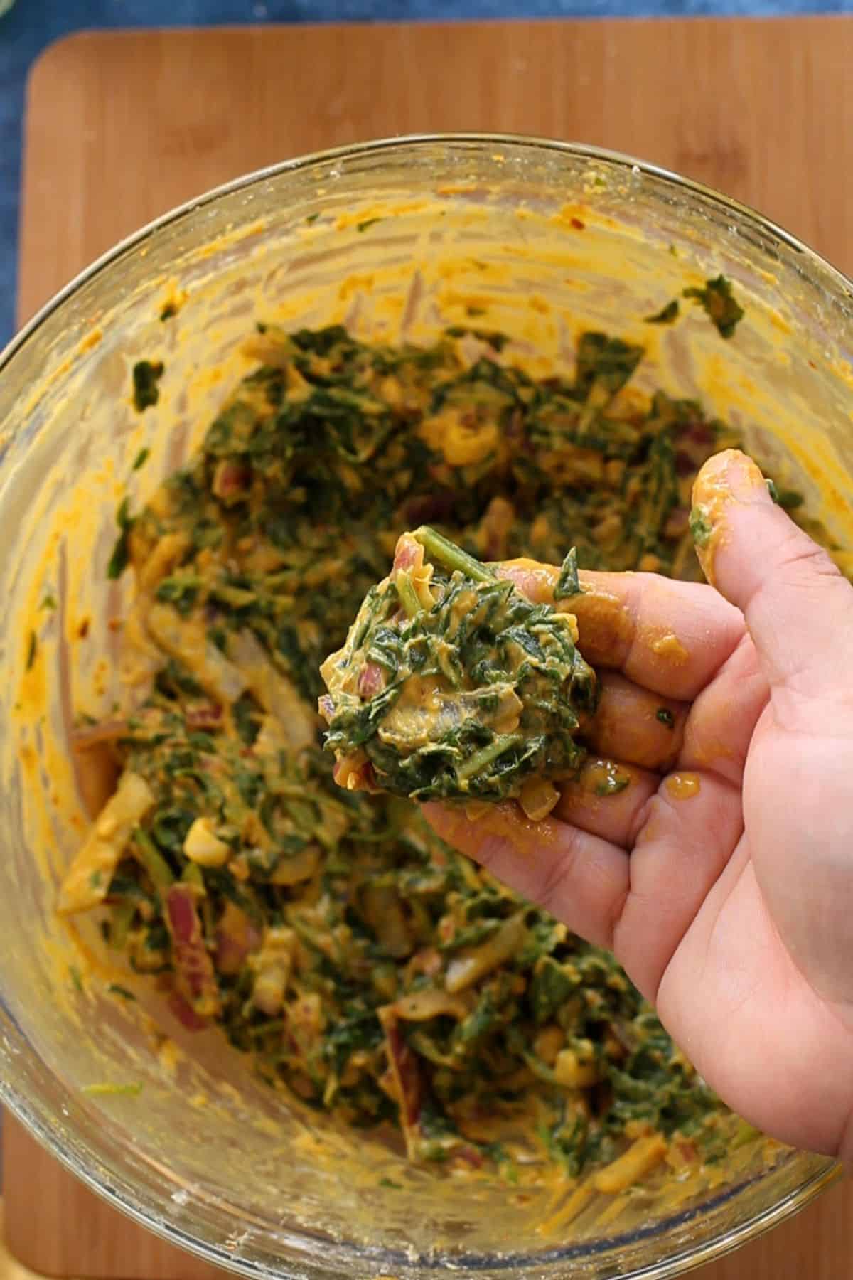 Shaping spinach pakoras.