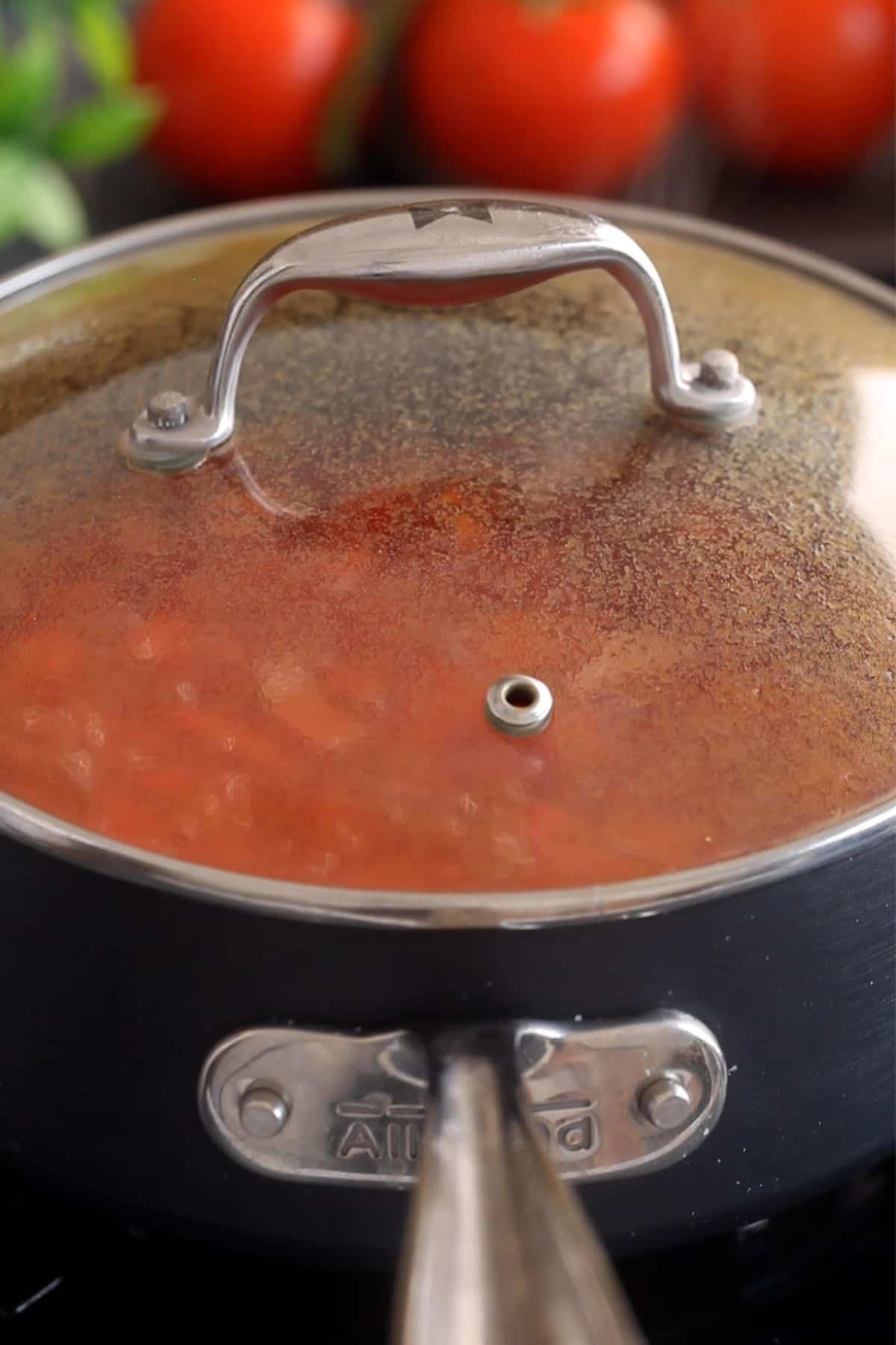 Cooking pot is covered and simmered until vegetables are soft.