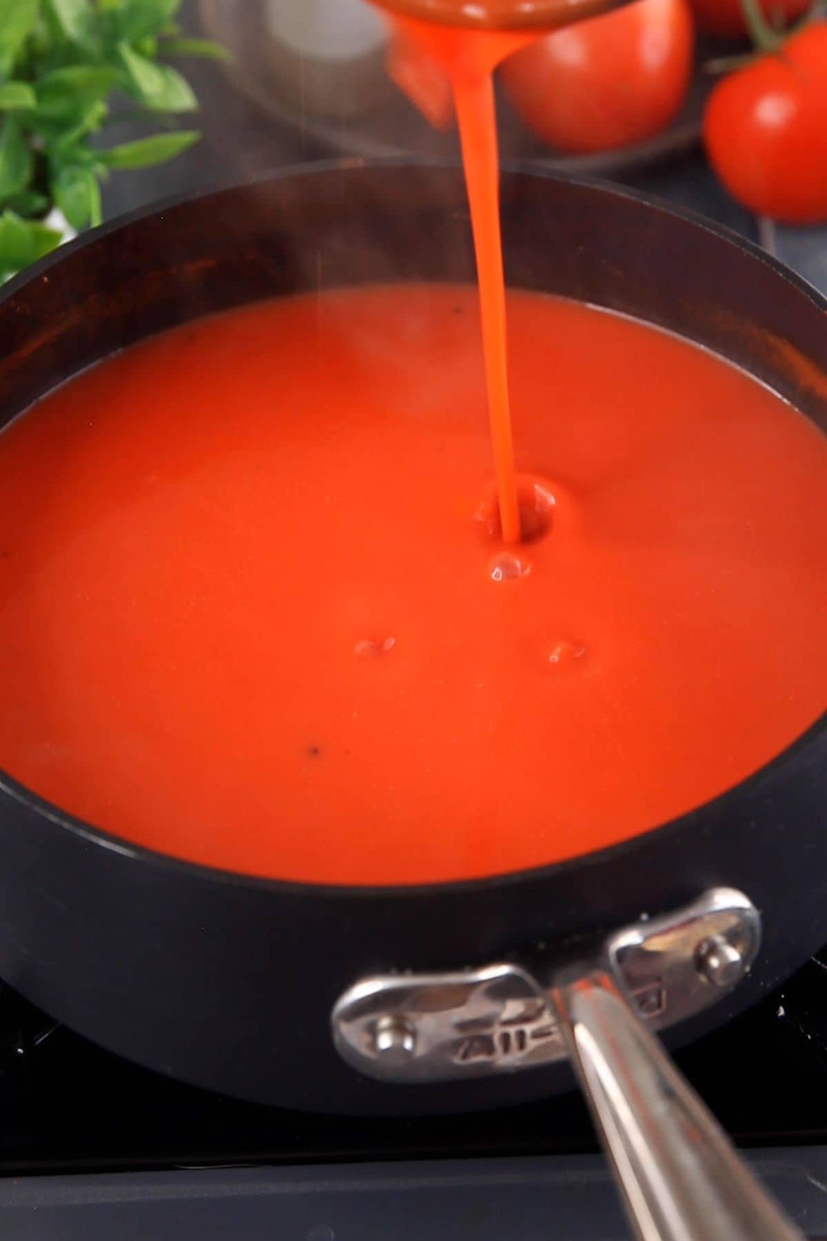 Indian tomato soup is simmered for few minutes and is ready to serve.
