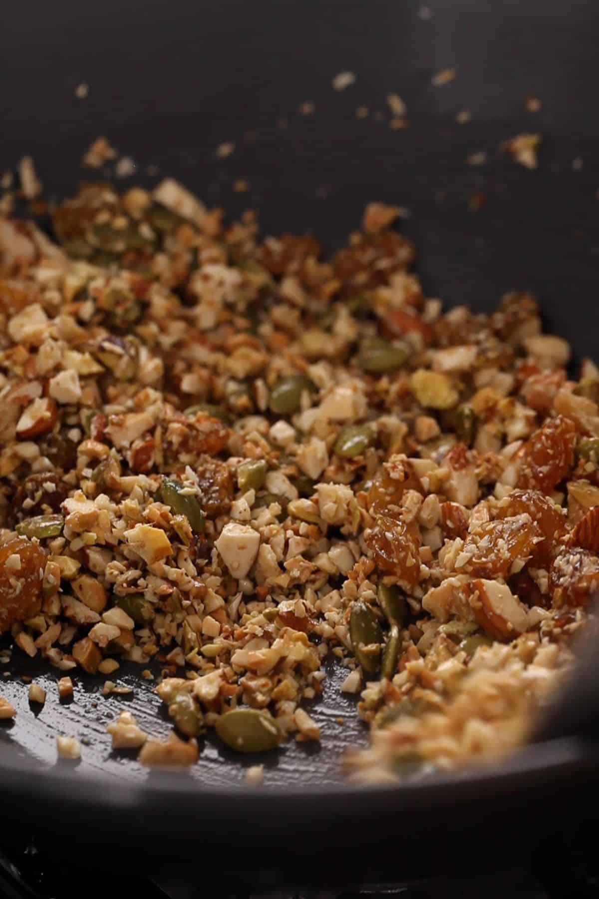 Nuts are being roasted in ghee.