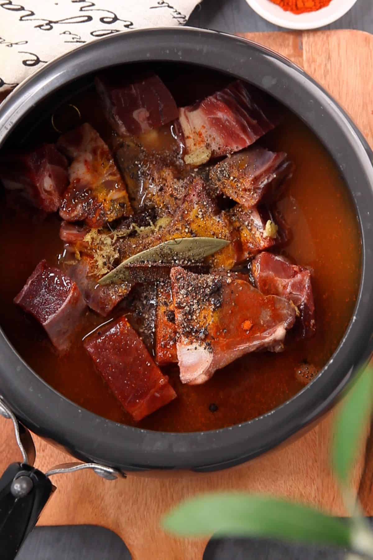 Water and oil is added to goat meat.