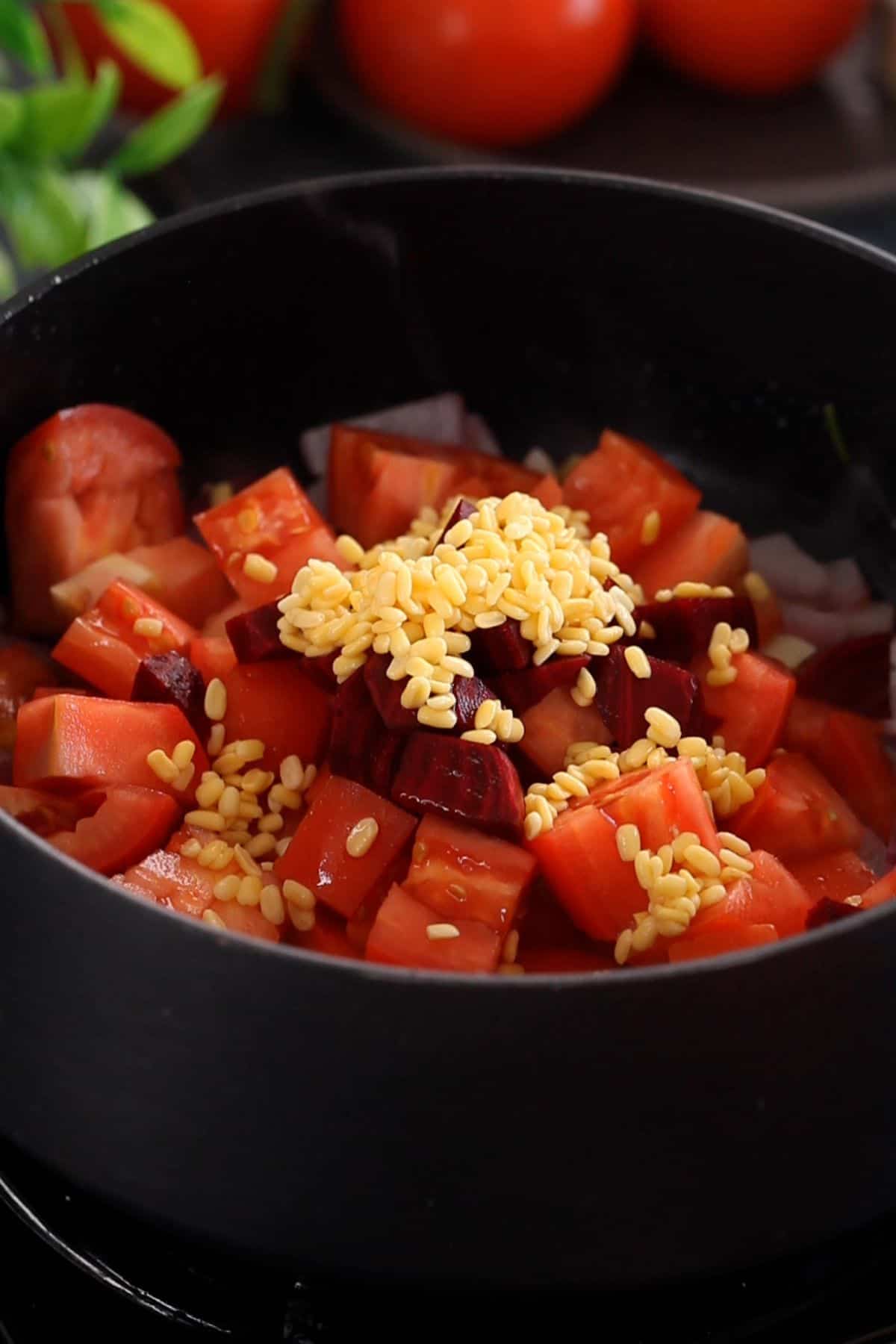 Chopepd tomatoes, soaked lentils and beet root are added next. 