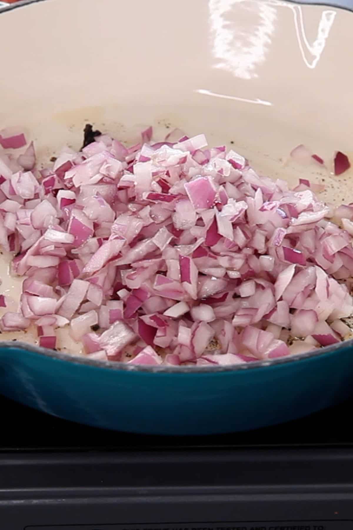 Chopped onion is added to the pan.