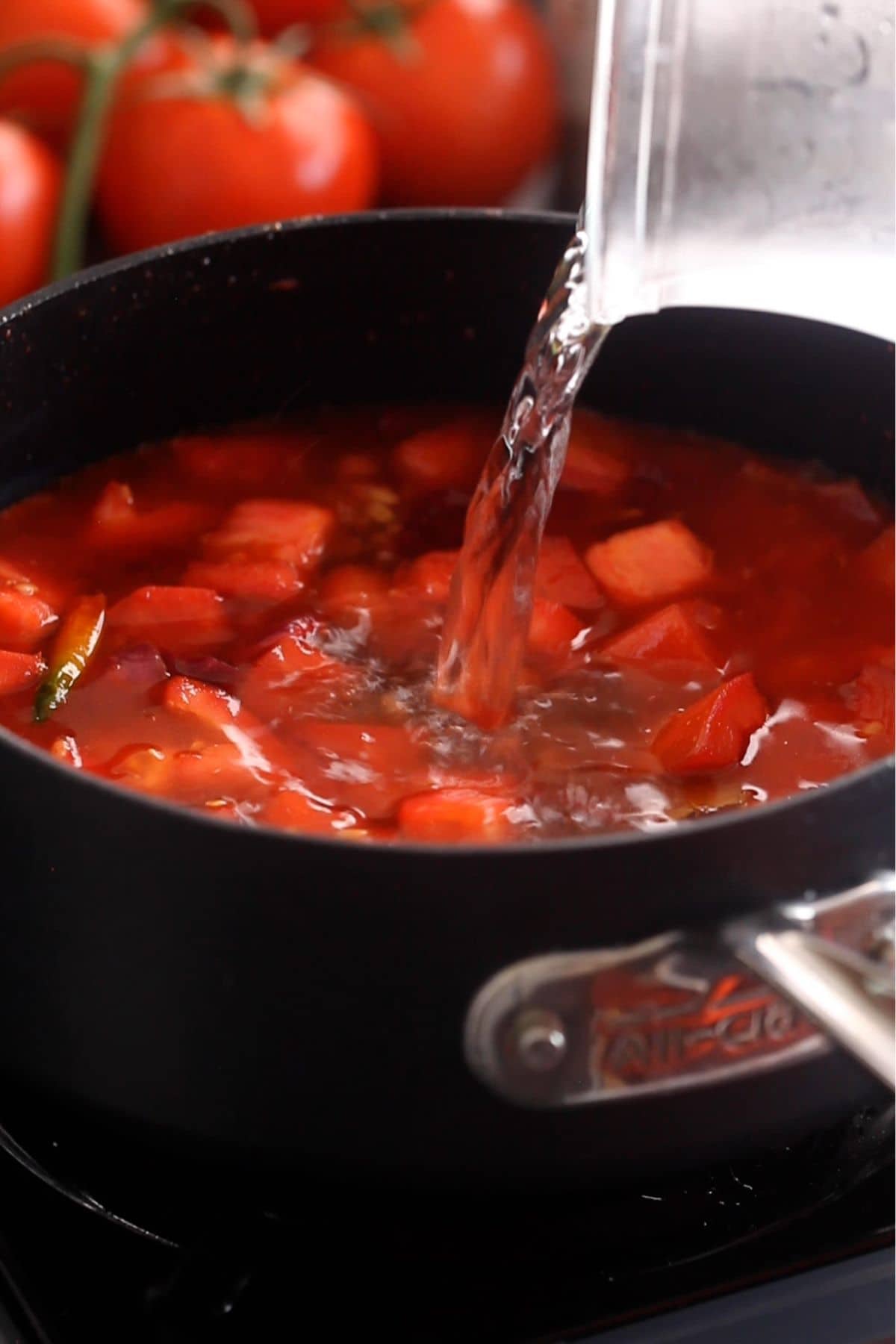 Hot water is added to the soup mixture. 
