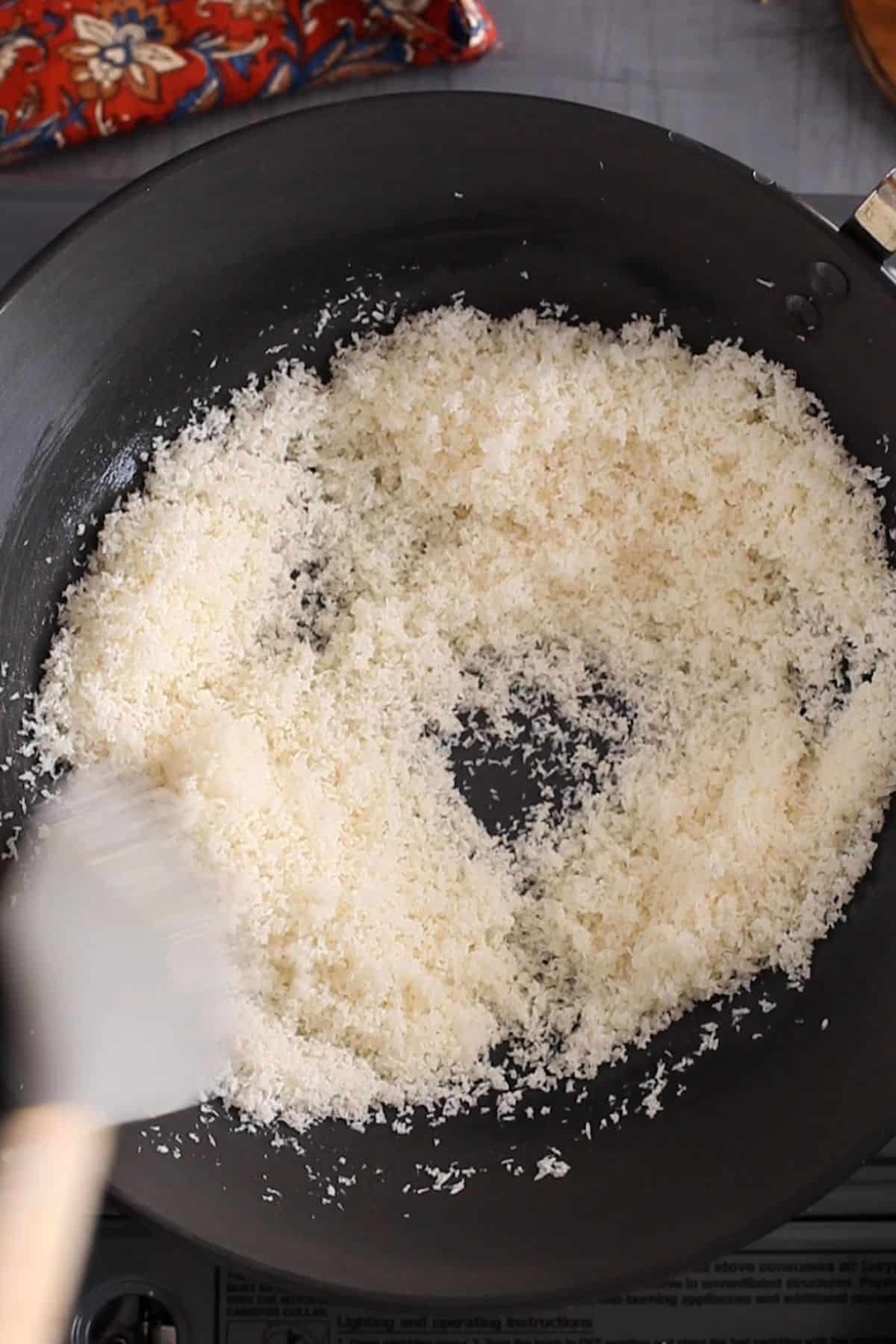 Toasting coconut on low heat.