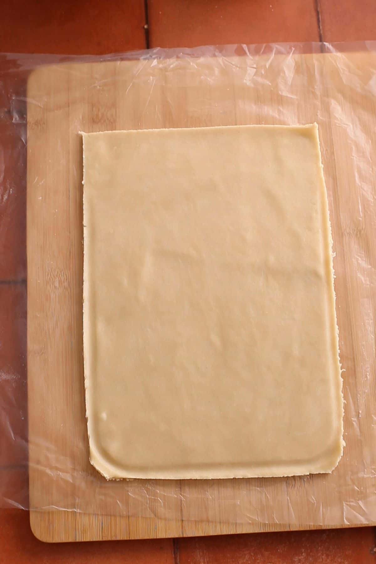 Cut up piece of pie crust ready to be stuffed.