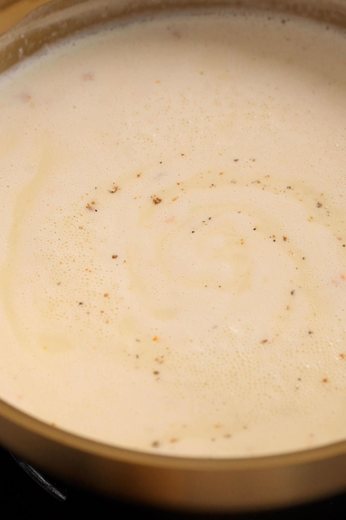 Custard is simmering on low medium heat.