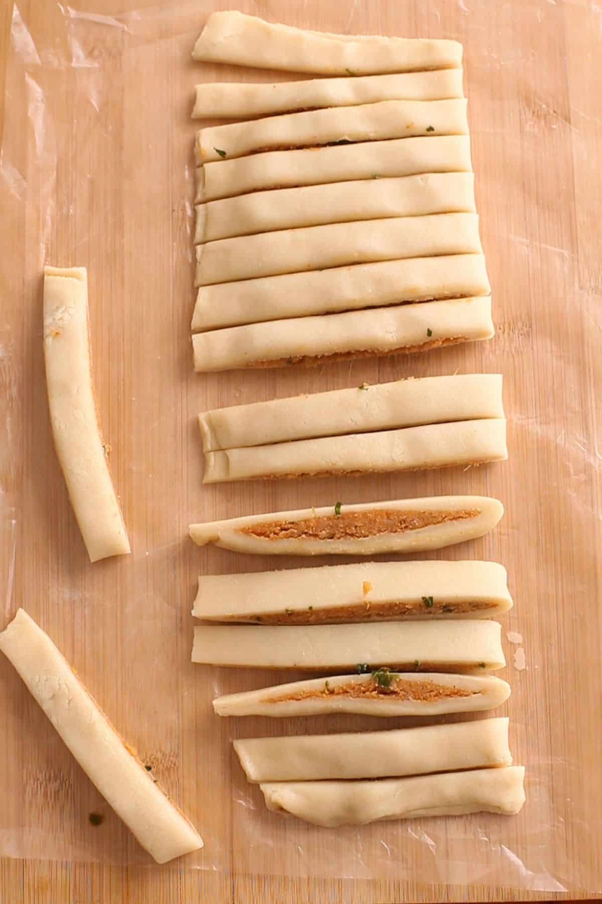 Samosa sticks are cut.