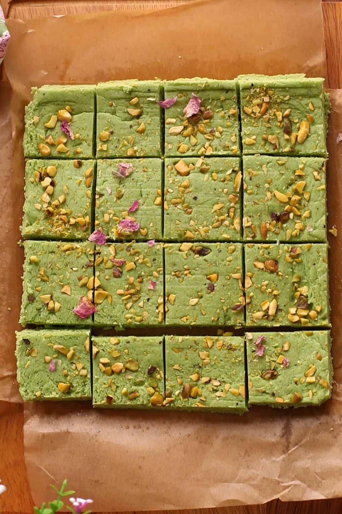 Pista burfi is cut into squares.