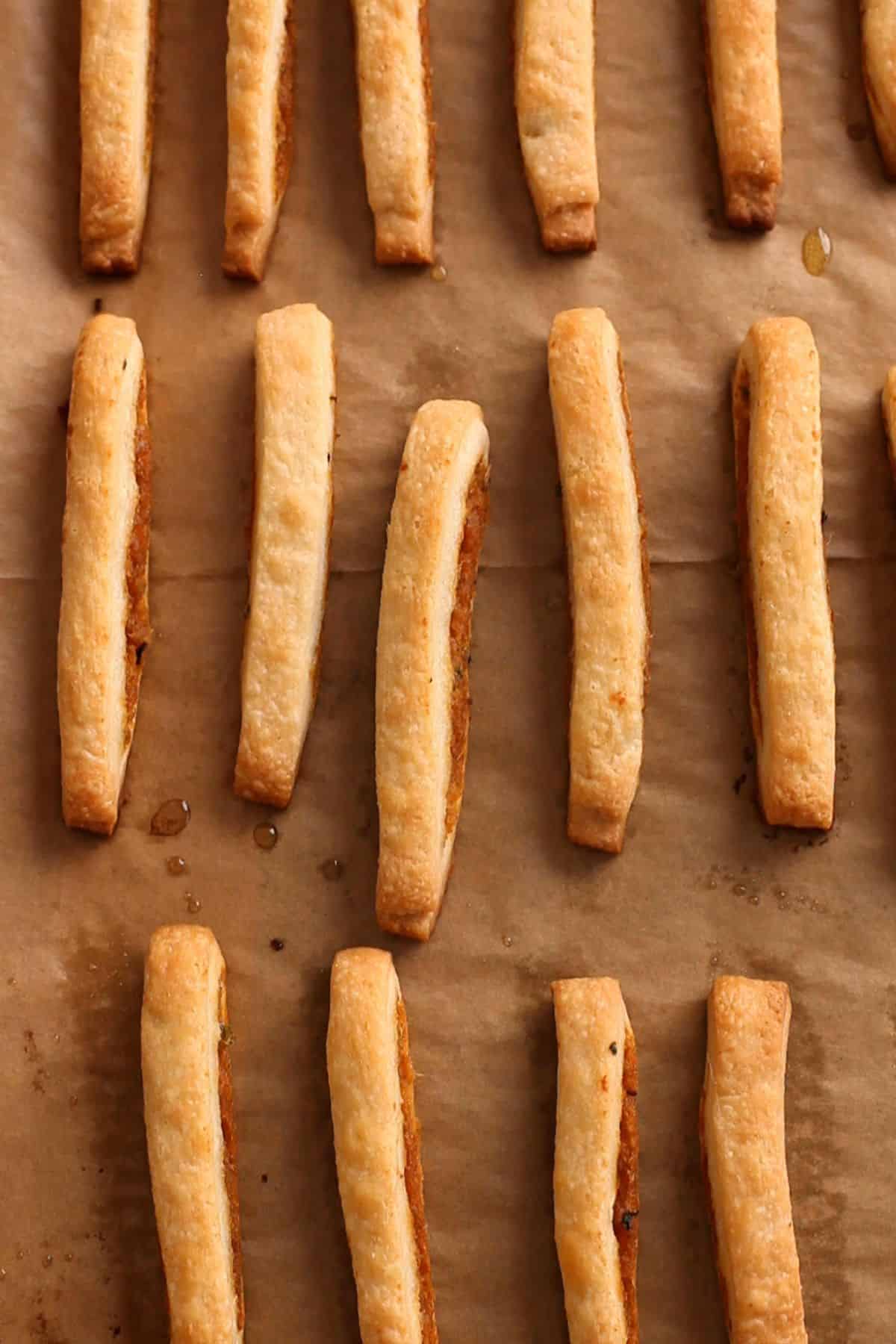 Baked golden brown samosa pie sticks.