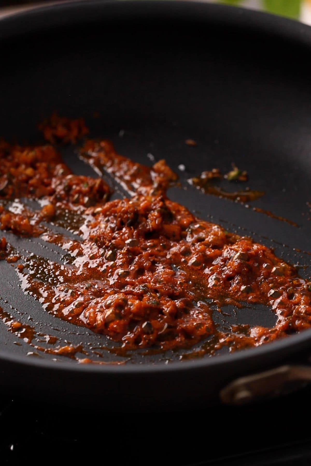 Red chili powder is added and fried.