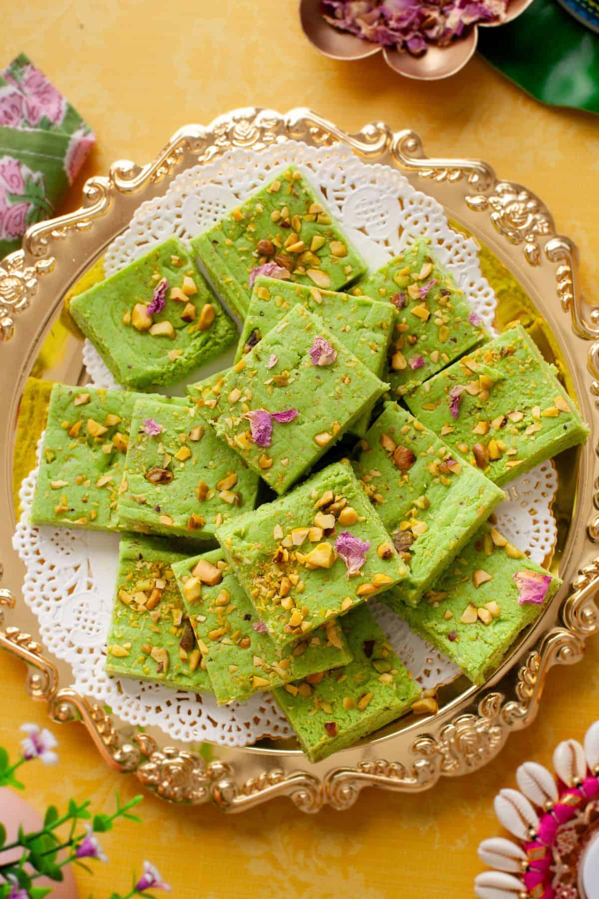 Pista burfi placed on a gold plate. 