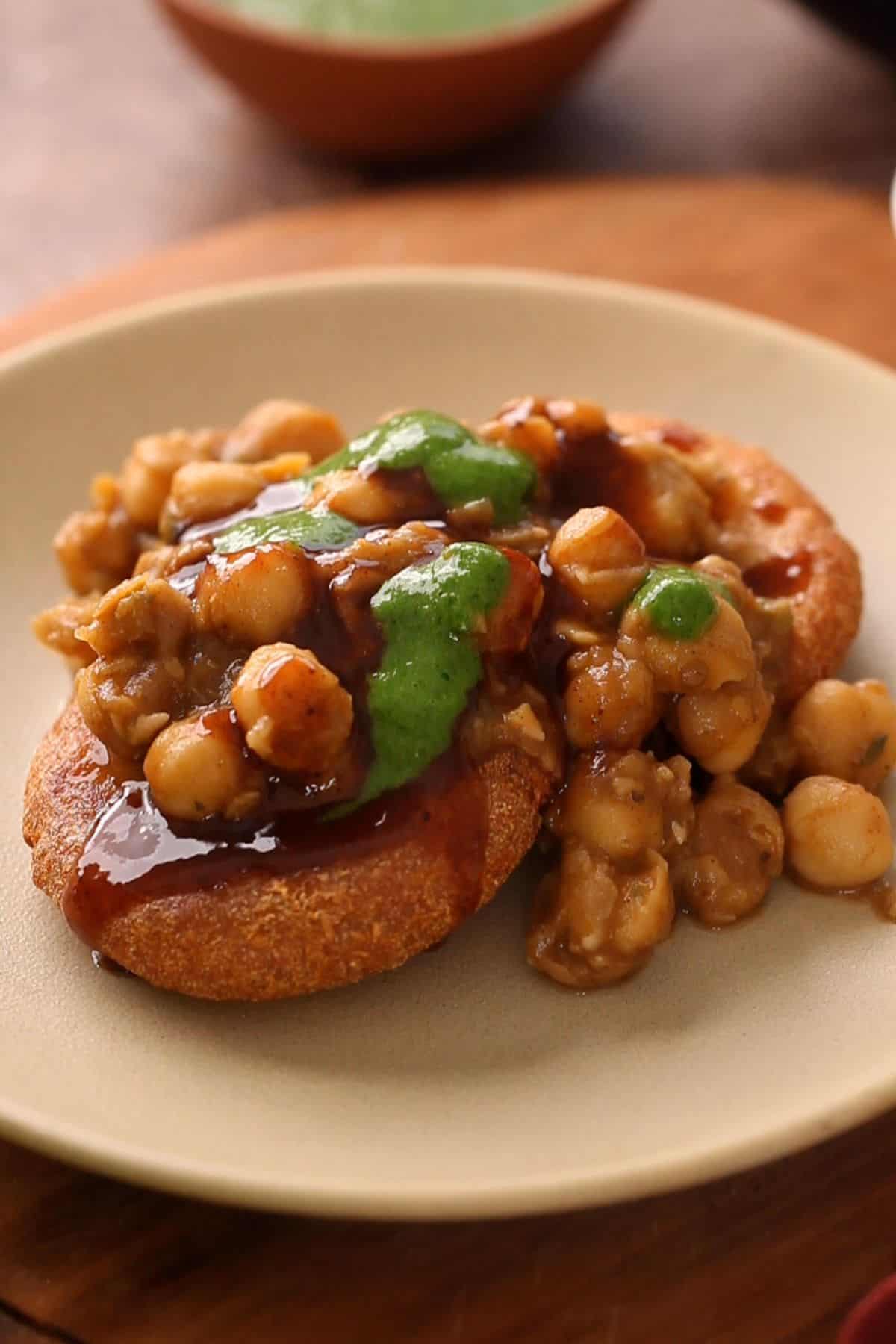 Aloo tikki chaat is plated with chutneys.