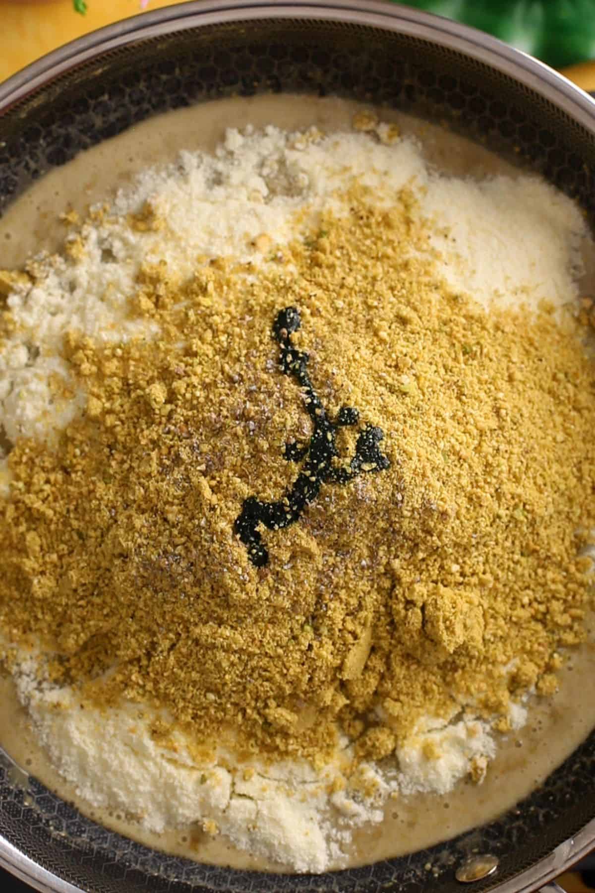 Dry ingredients, flavorings and green food color is added next to the wet ingredients.