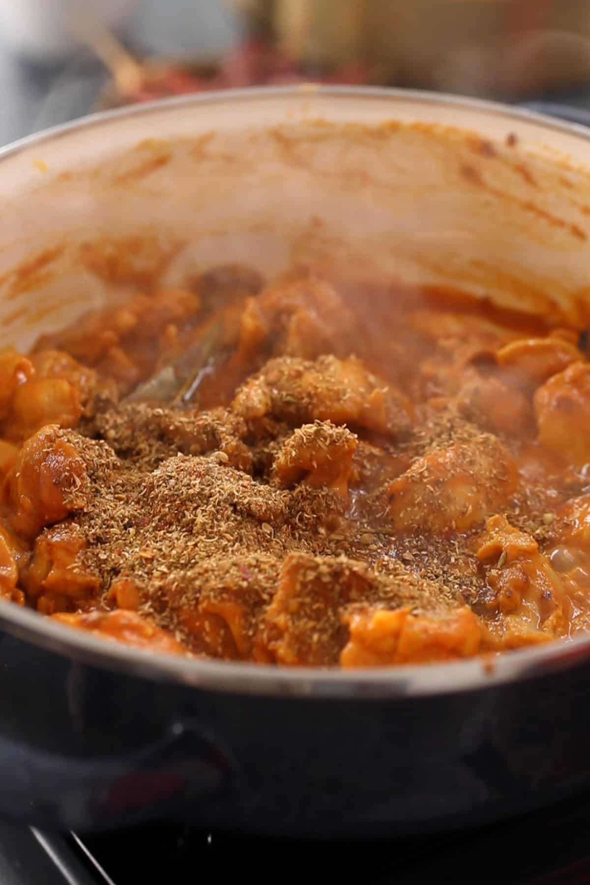 Homemade kadai masala is added to kadai chicken.