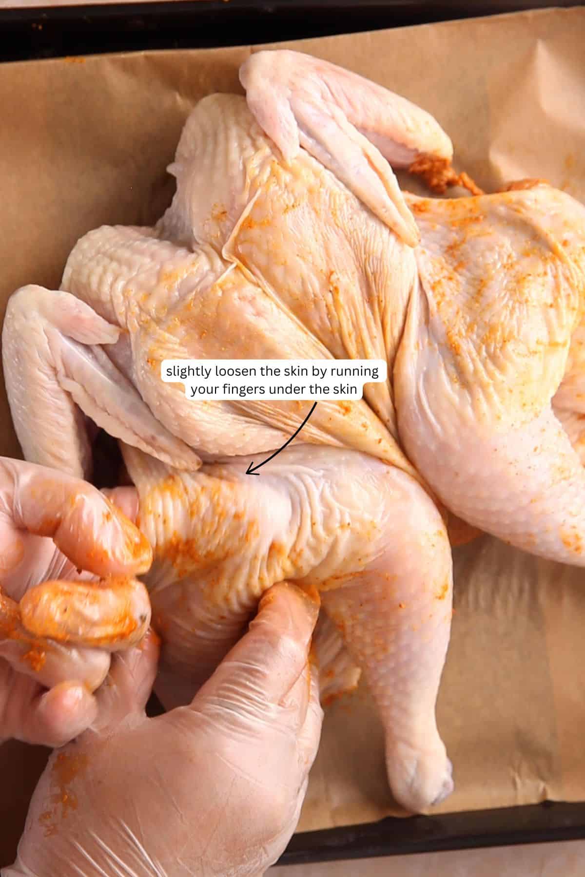 Image showing how to loosen chicken skin.