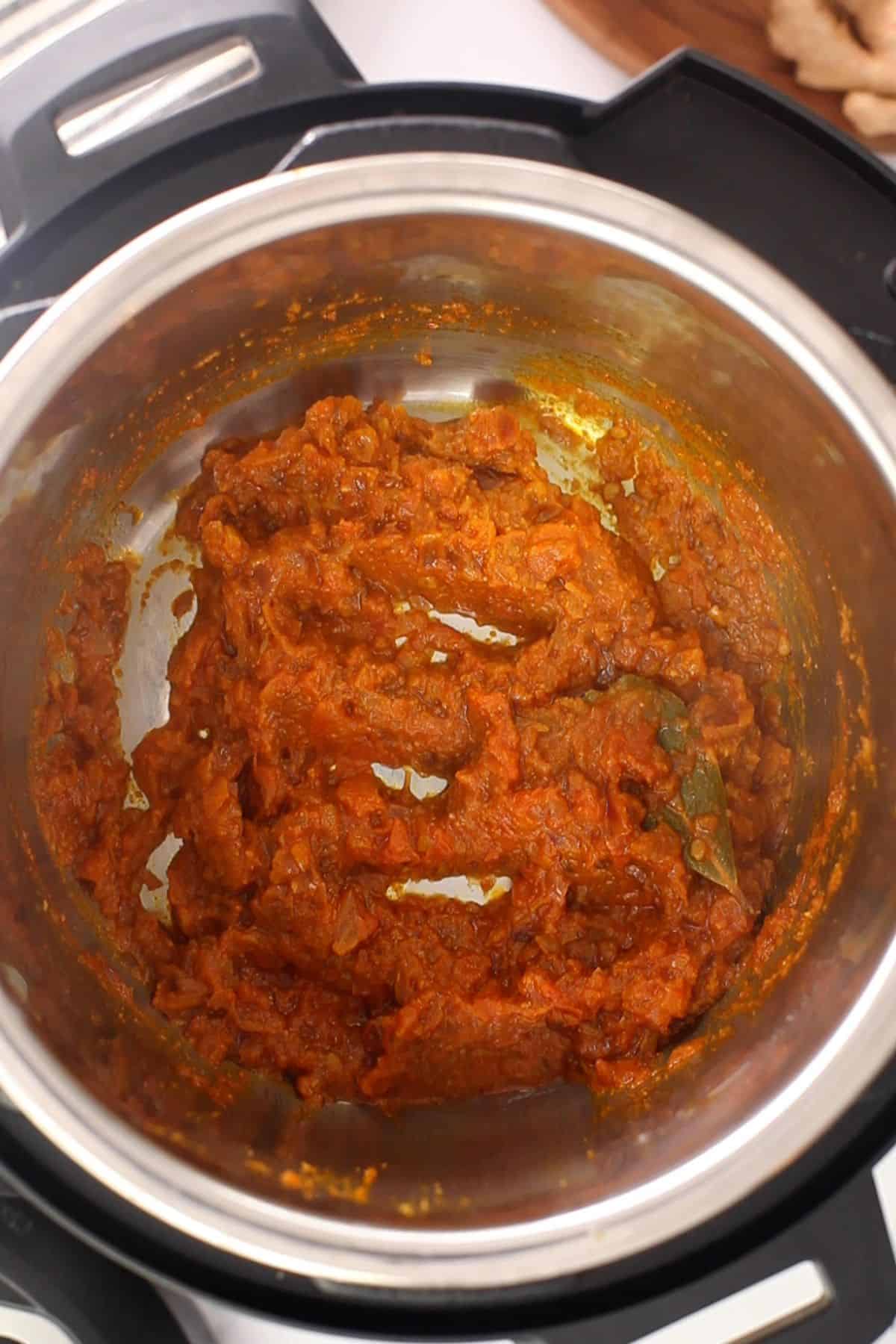 Masala is cooked until it has a jammy consistency.