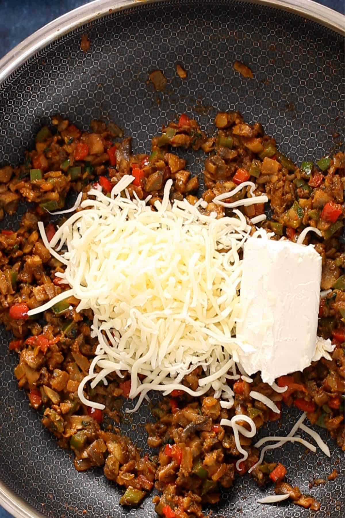 Cream cheese and mozarella cheese is added to mushroom filling. 