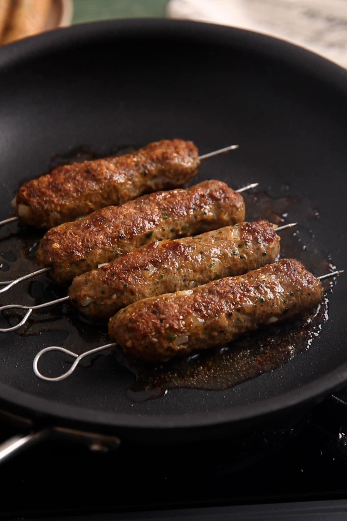Seekh kebabs are pan fried with charred skins.
