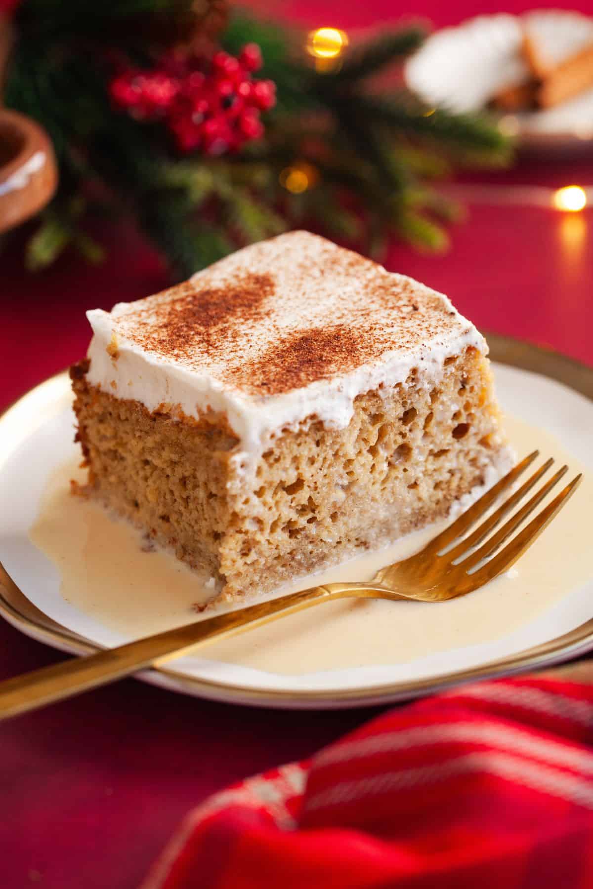 Close up of a sliced of ginger bread leches cake.