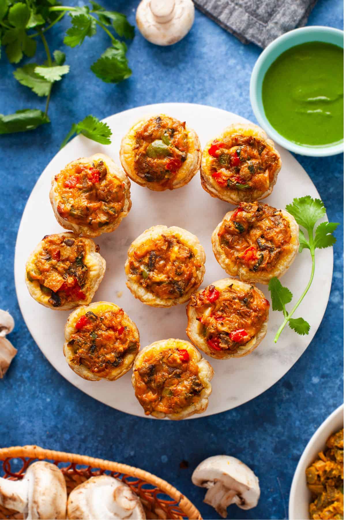 Masala Mushroom tartlets served with green chutney.