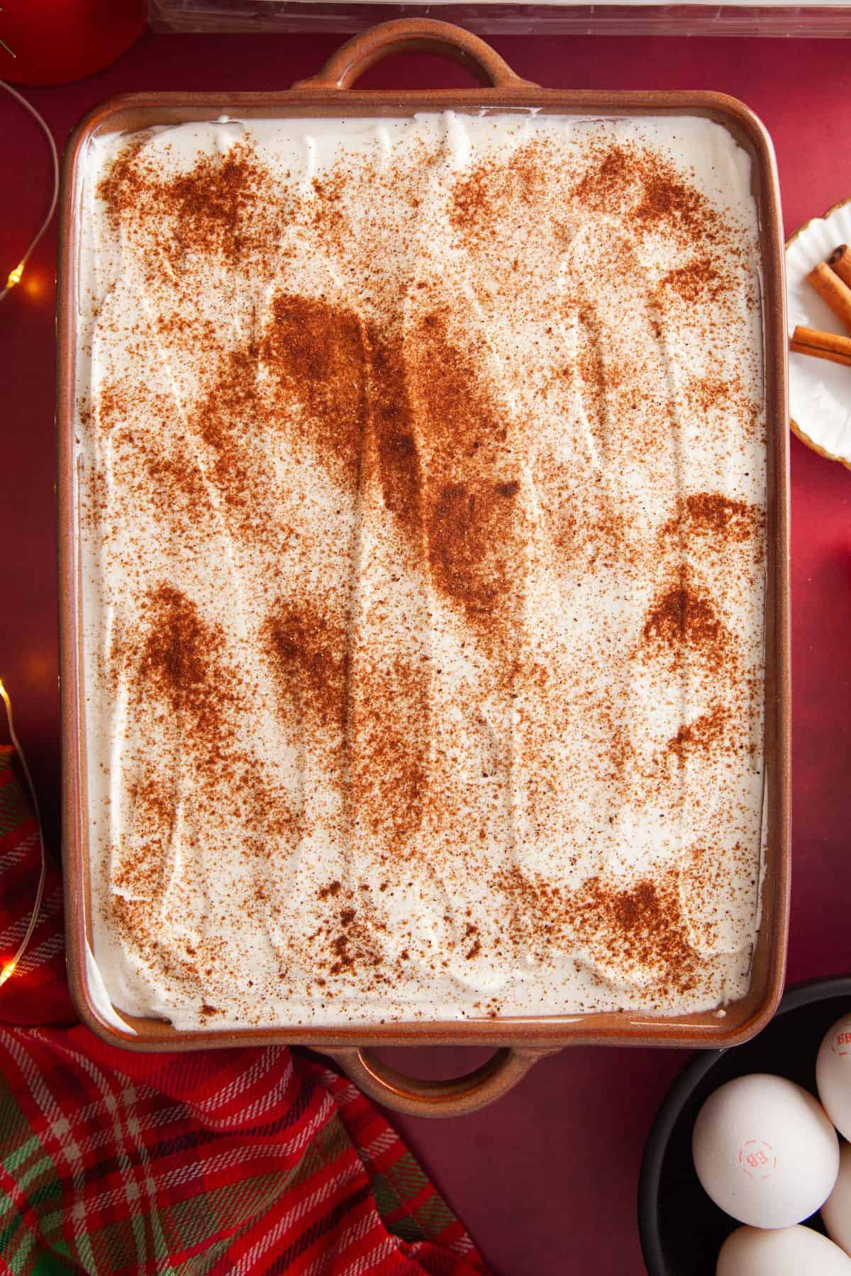 Whole Gingerbread tres leches cake in a brown baking tray.