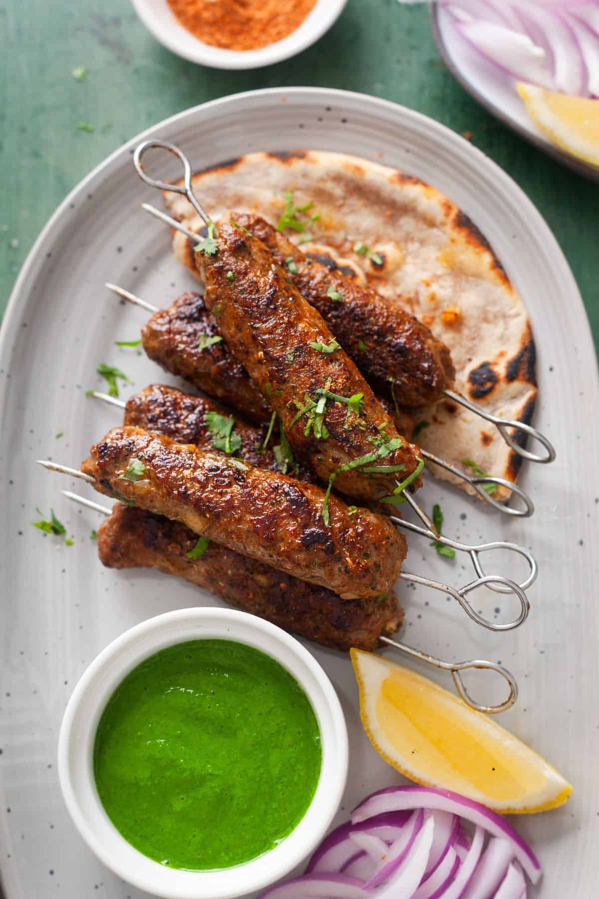 Closeup of lamb seekh kebabs.