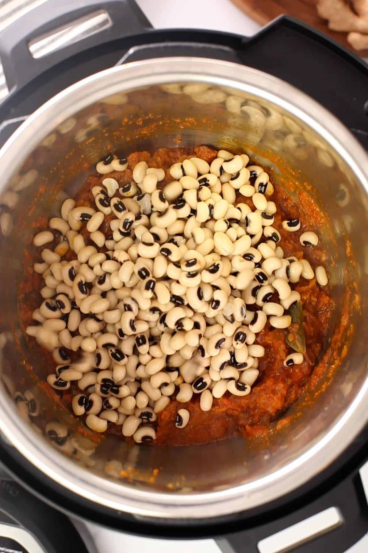 Soaked lobia beans are added to the masala.