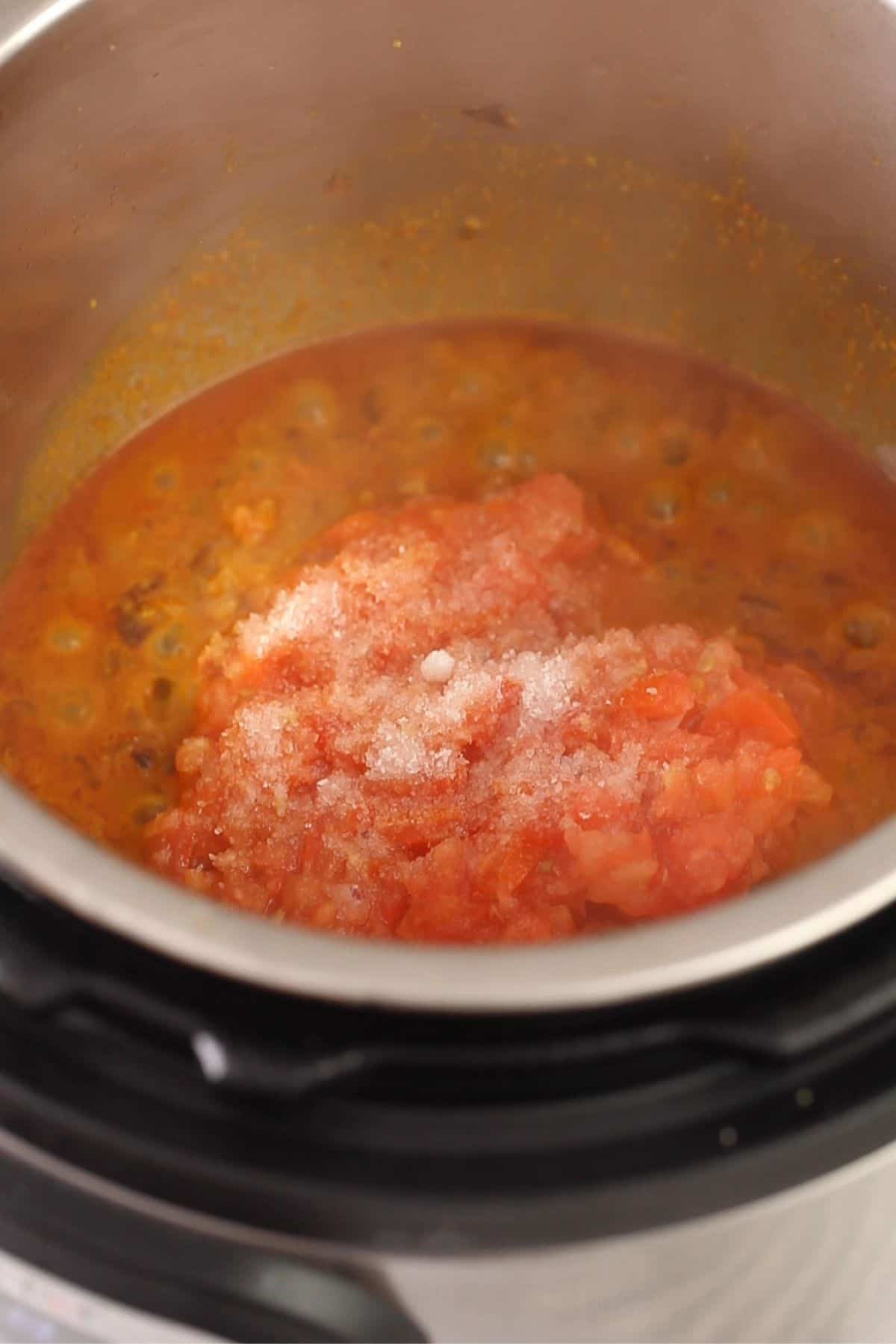 Tomatoes and salt are added next.