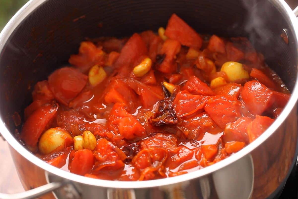 Tomatoes are beginning to release their juices.